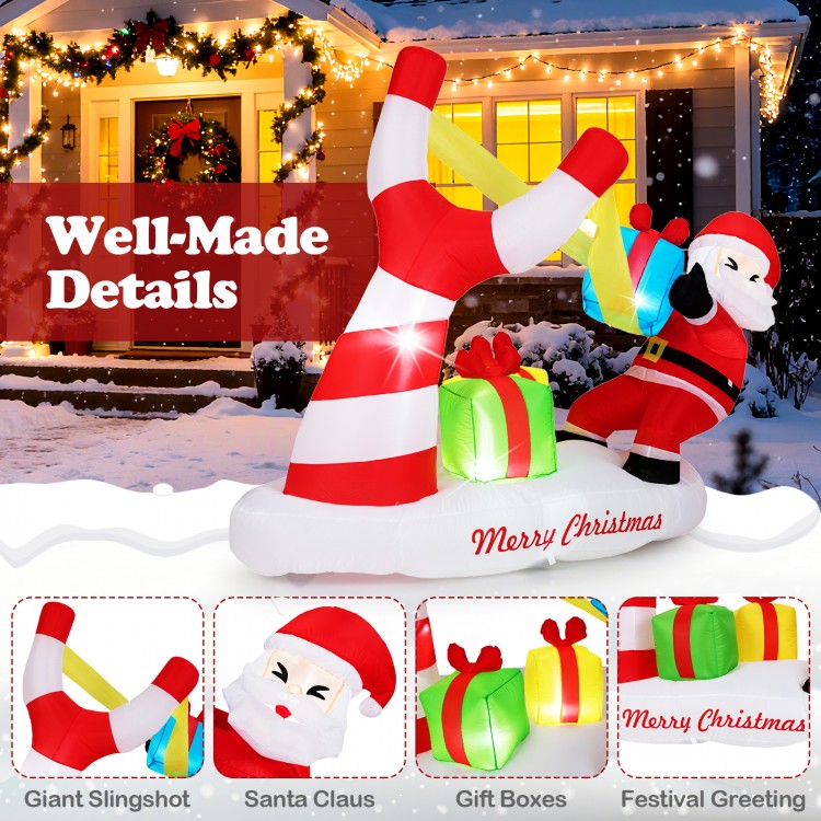 7-foot Christmas inflatable featuring Santa with a slingshot, LED lights, and gift boxes for festive outdoor decoration.