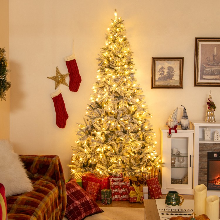 Half artificial Christmas tree with 852 flocked branch tips, LED lights, and a cozy snowy look, perfect for.