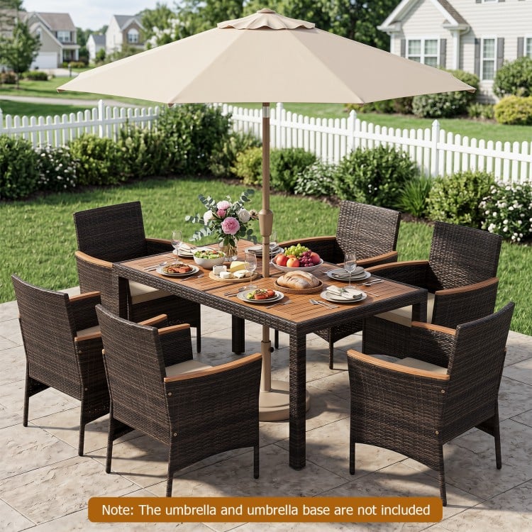 Close-up of the padded cushion and acacia wood armrest on a brown patio dining chair, designed for outdoor comfort.