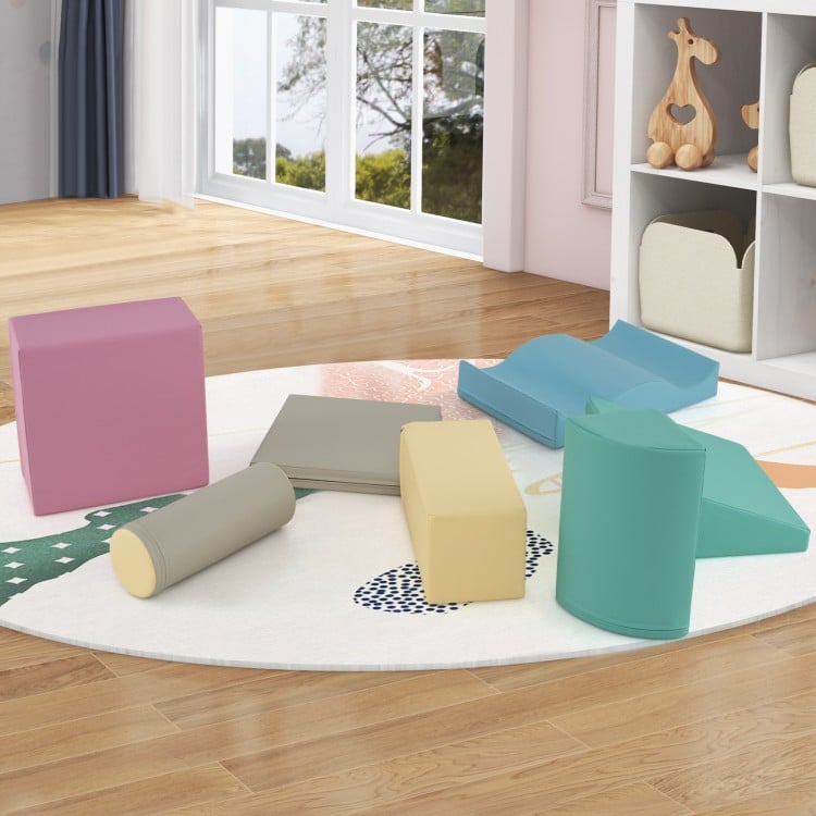 Colorful 7-piece soft play equipment set featuring diverse foam climbing blocks for indoor play and creativity.