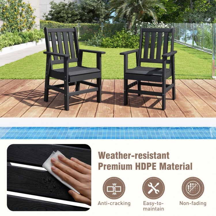 Two black HDPE patio chairs with armrests, showcasing weather resistance and rustic charm for outdoor dining.