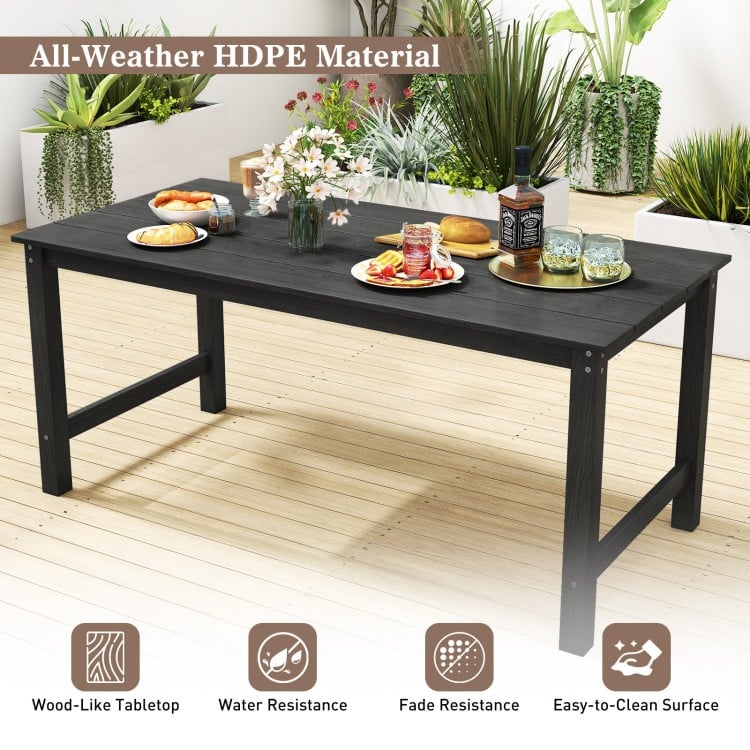 Black patio dining table made of all-weather HDPE, featuring a wood-like surface and ample 67” x 32” space for outdoor.