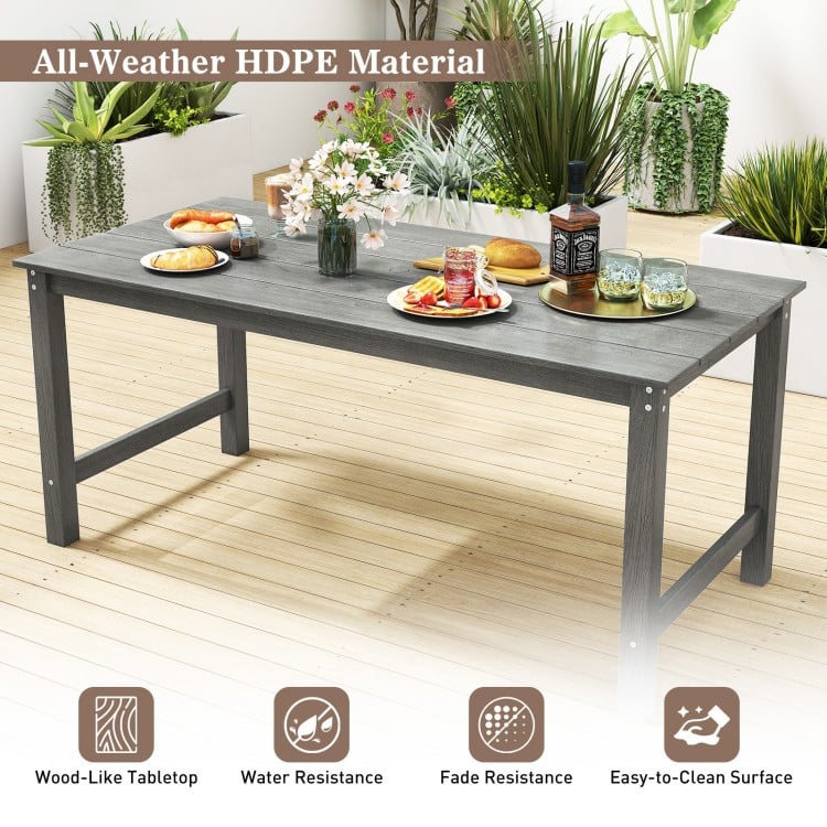 Grey patio dining table made of all-weather HDPE material, featuring a wood-like surface and ample 67" x 32" tabletop.
