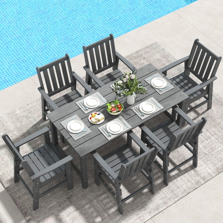 7-piece grey patio dining set with HDPE table and chairs, featuring a large tabletop and rustic wood-like surface.