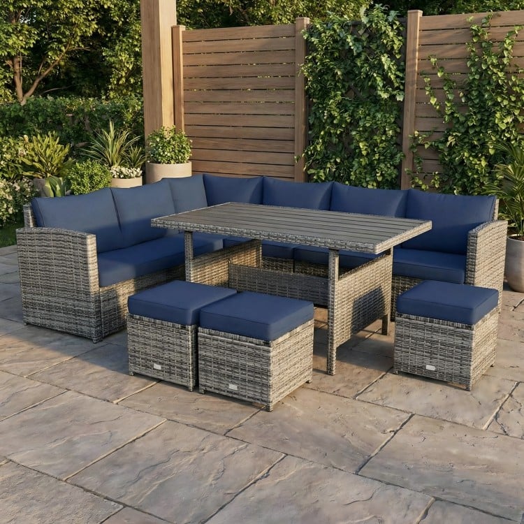 Close-up of the navy cushion on the ottoman from the 7-piece patio rattan dining set, designed for outdoor comfort.