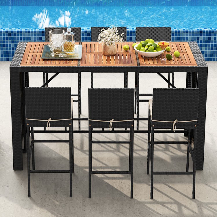 Patio rattan bar set featuring an acacia wood tabletop and soft seat cushions, ideal for outdoor gatherings by the poolside.