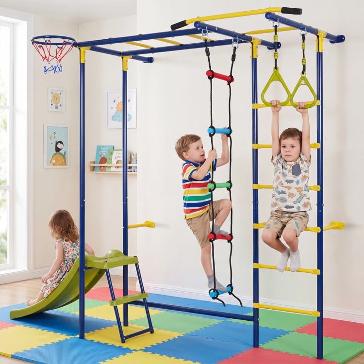 Indoor jungle gym for toddlers featuring climbing rings, slide, and basketball loop for active play and coordination development.
