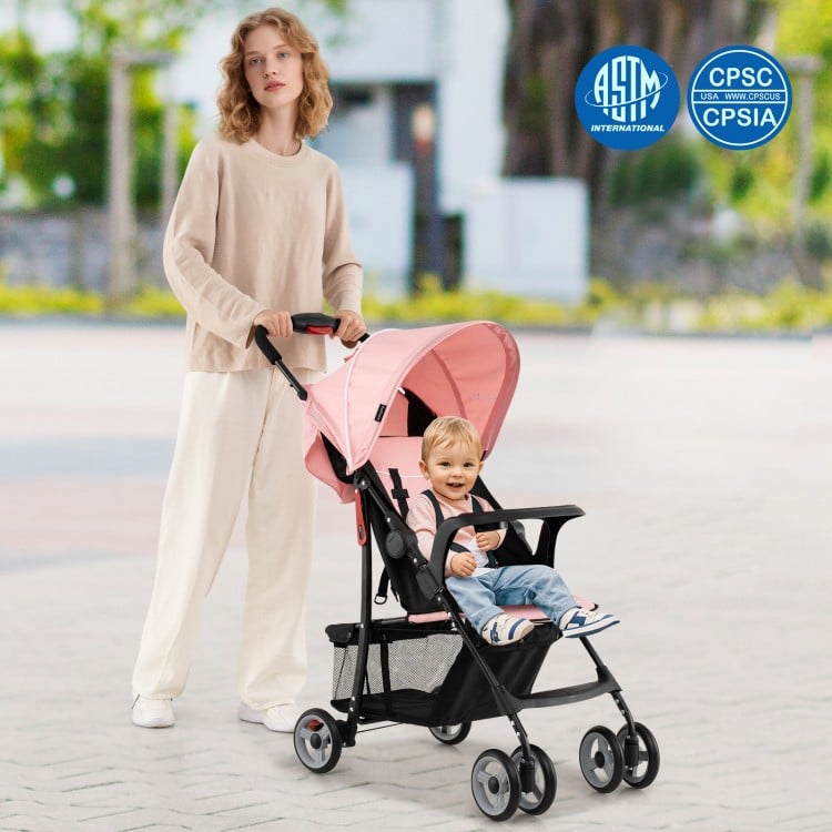 Toddler travel stroller in pink with adjustable backrest, canopy, and 5-point safety harness for comfortable outings.