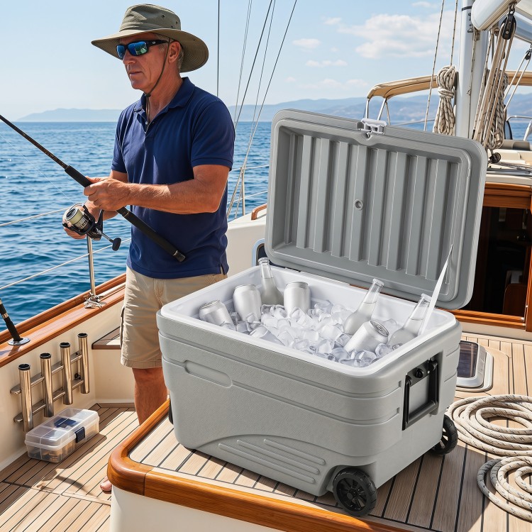 Portable 84 Quart wheeled ice cooler in gray with ice and drinks, ideal for fishing trips and outdoor activities.