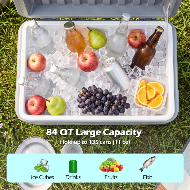 Portable 84 QT wheeled ice cooler with fruits, drinks, and ice cubes, designed for easy transport and long-lasting ice retention.