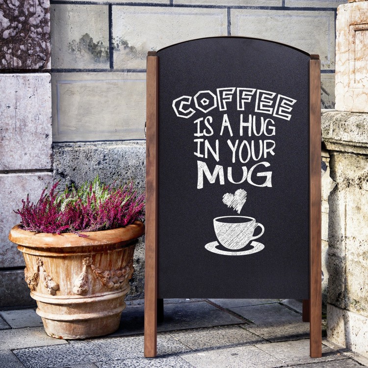 A-Frame sidewalk chalkboard sign displaying "Coffee is a hug in your mug" for outdoor advertising and promotions.