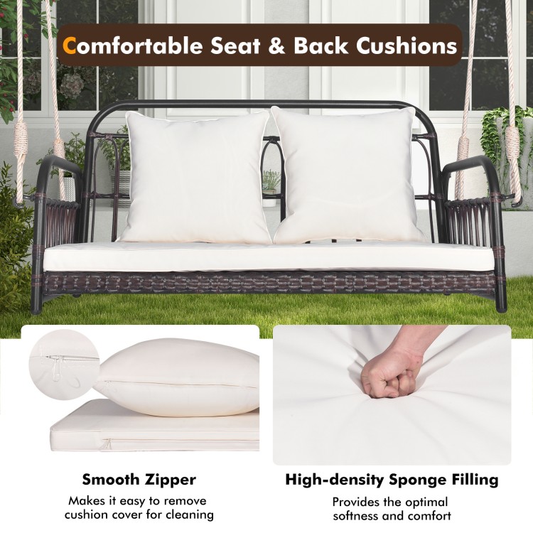 Wicker hanging porch swing with white cushions, featuring removable covers and 880 lbs capacity for outdoor relaxation.