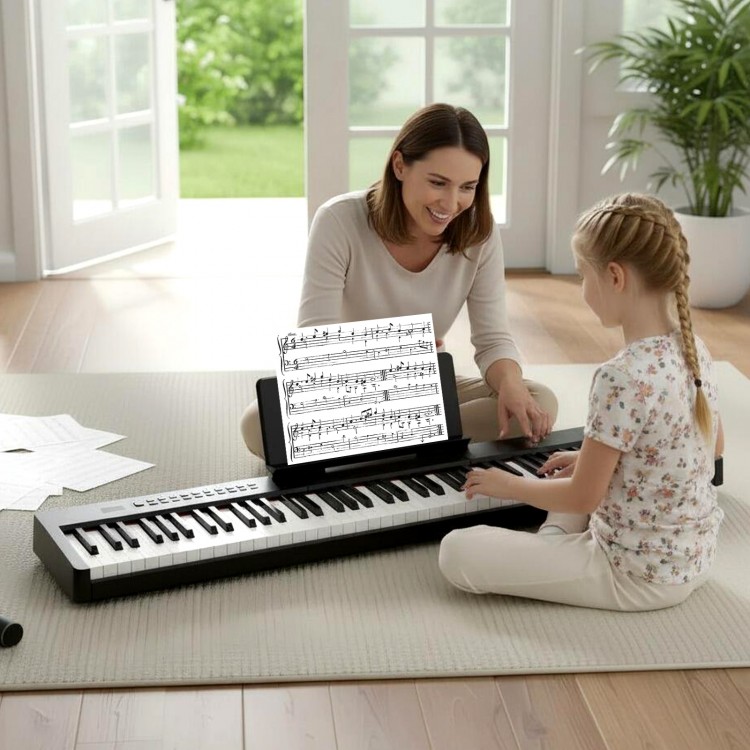 A mother and daughter enjoy playing together on the 88 keys black piano keyboard, featuring a French DREAM audio source.