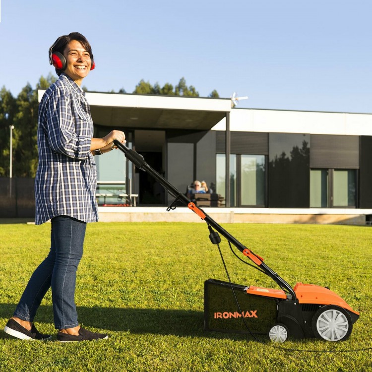 Electric scarifier with collection bag in use, featuring adjustable depth and powerful motor for efficient lawn care.