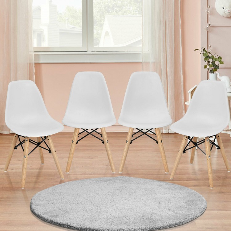 Set of four white mini DSW chairs with wood legs, perfect for kids' playrooms and study areas.