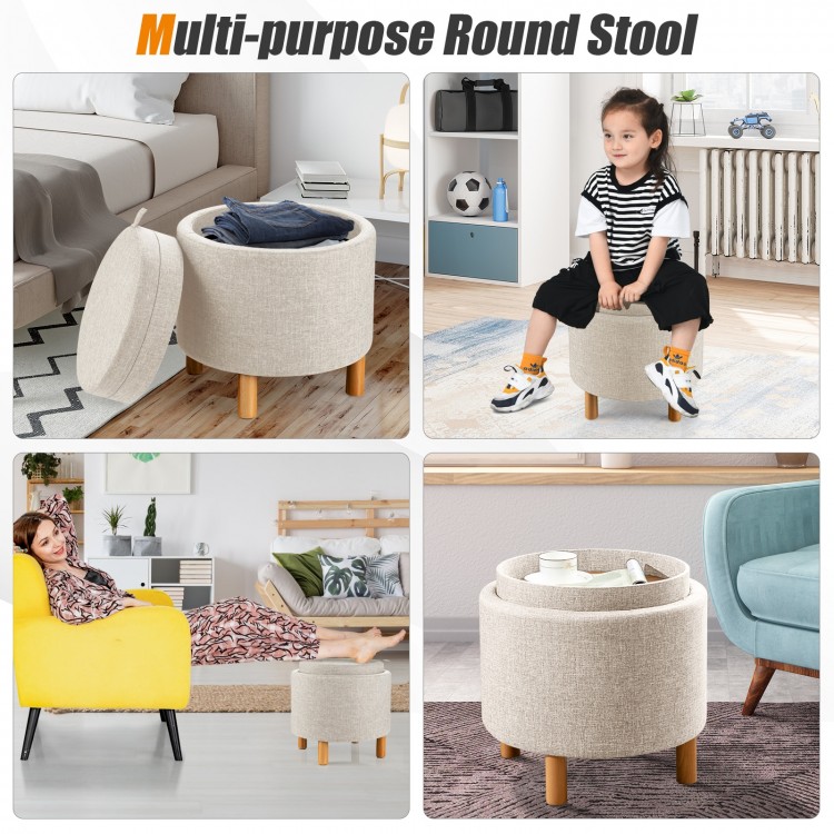 Round beige fabric storage ottoman with removable lid and wooden tray, perfect for living room or bedroom use.