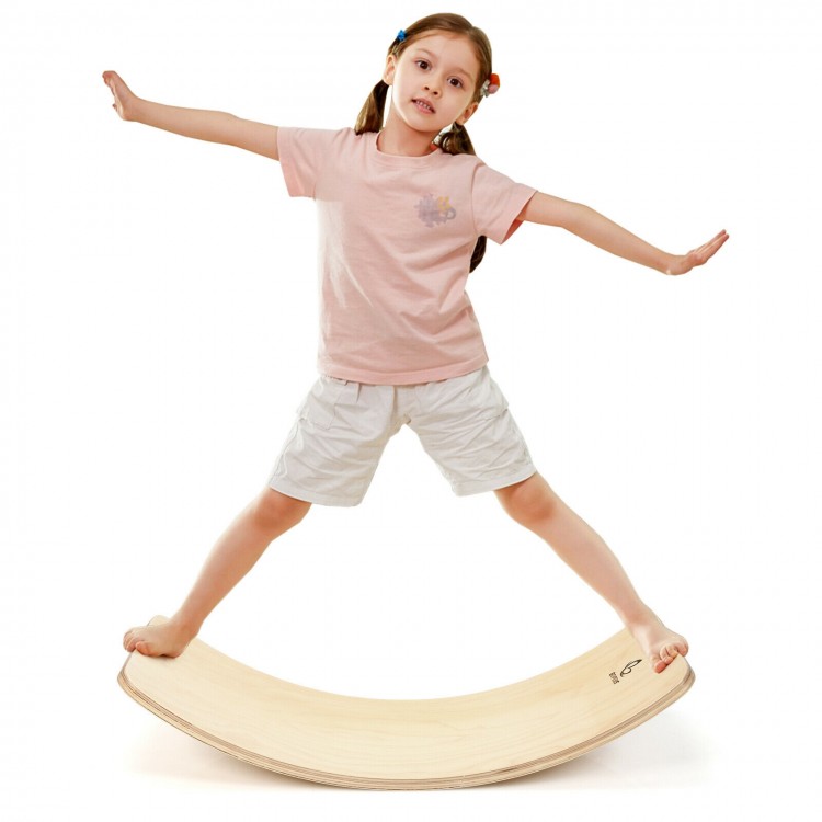 Child balancing on a wooden wobble balance board made of premium birch, promoting healthy posture and fun activities.