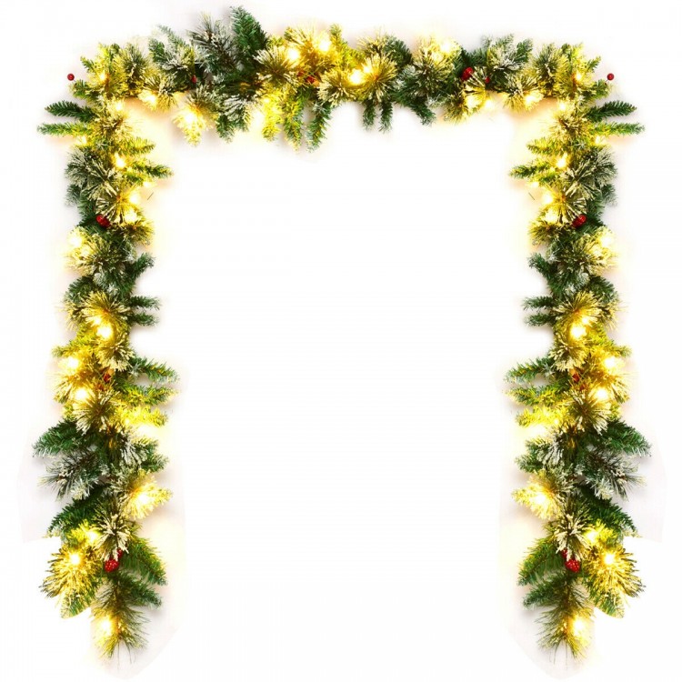 9-foot pre-lit Christmas garland with snow flocked tips and red berries, featuring 50 warm white LED lights for festive.