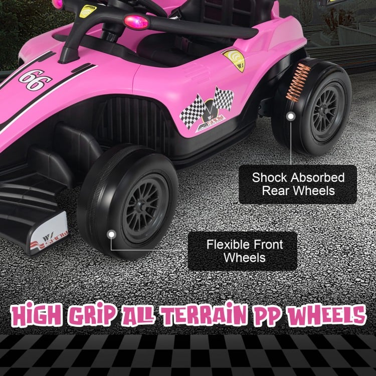 Close-up of the pink 12V kids ride-on electric Formula racing car showcasing high grip all-terrain PP wheels for.