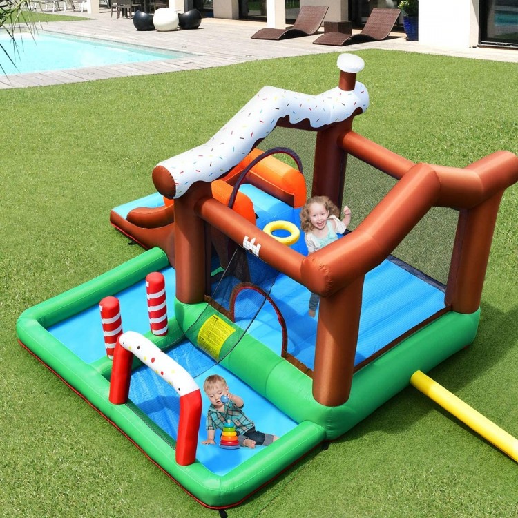 Inflatable kids bounce house featuring a slide, climbing wall, and ball pit for outdoor fun in the backyard.