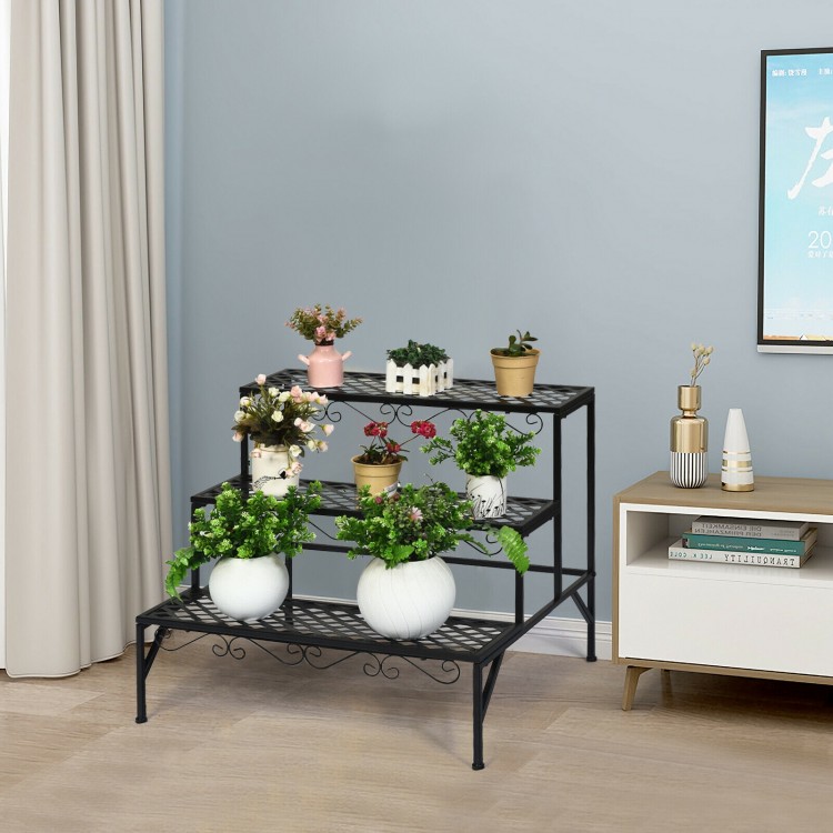 Ladder-style three-tier metal plant stand with decorative patterns, offering ample space for various plants indoors or.