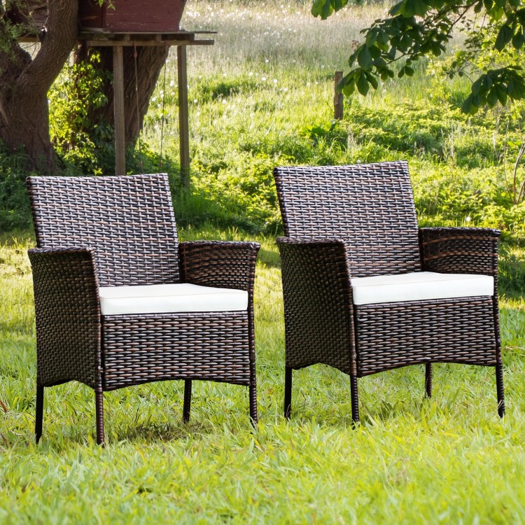 Set of 2 outdoor PE rattan armchairs with removable waterproof cushions, perfect for backyard and patio relaxation.