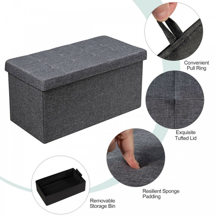 Foldable dark gray fabric storage ottoman with tufted lid and removable bin, ideal for organizing clothes and blankets.