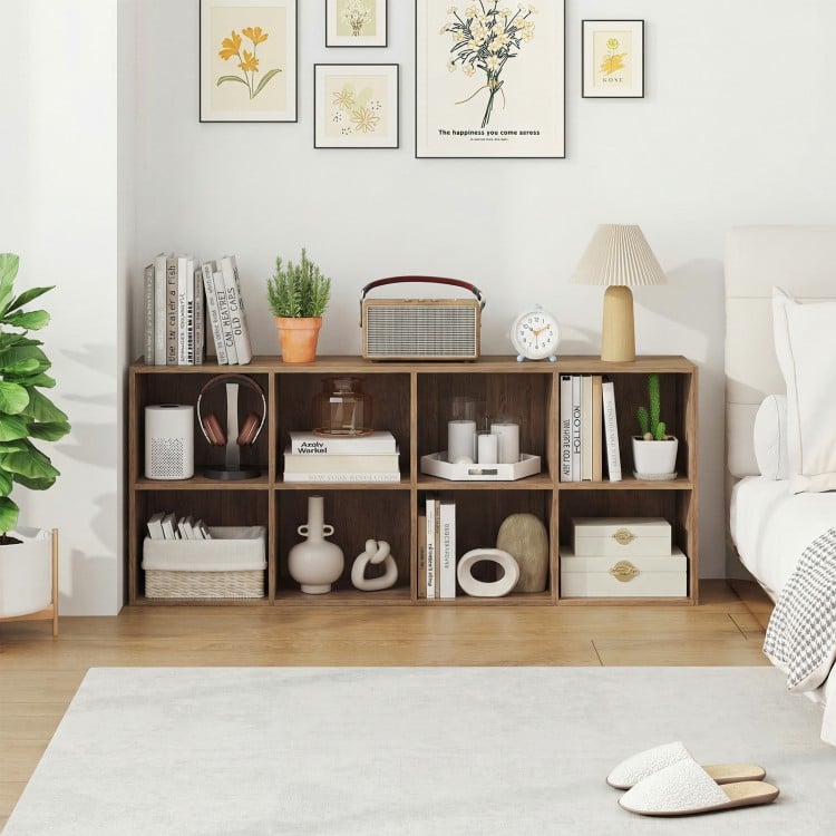 8-cube bookcase in natural finish with decorative items, perfect for organizing books and decor in any room.
