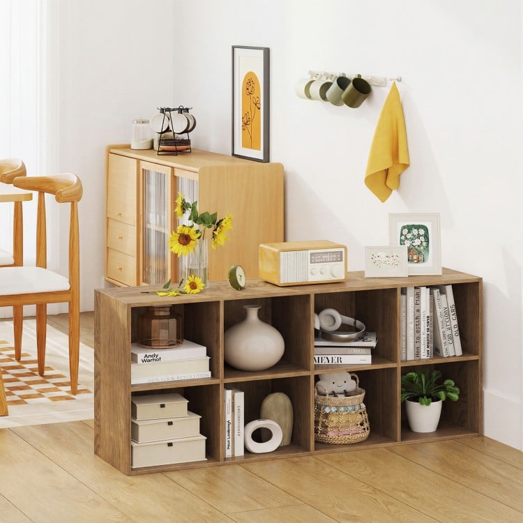 8-cube bookshelf in natural finish with storage bins and decor, ideal for organizing and displaying items in any room.
