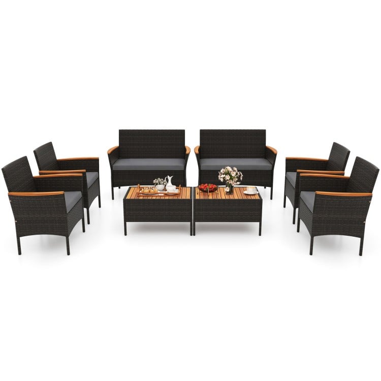 8-piece patio wicker sofa set featuring 4 rattan chairs, 2 loveseats, and 2 tables with acacia wood accents for outdoor.