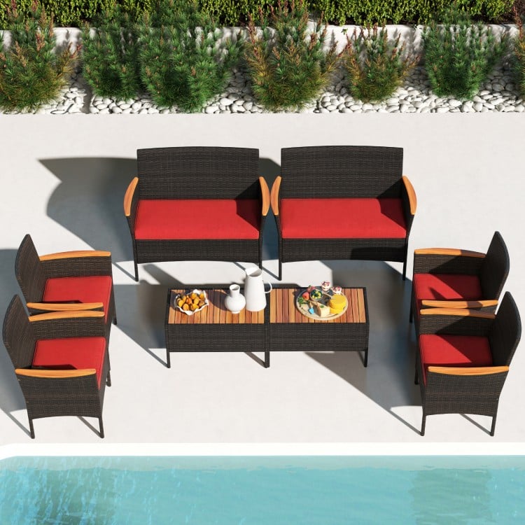 8-piece patio wicker sofa set featuring 4 rattan chairs and 2 loveseats with red cushions, ideal for outdoor relaxation.