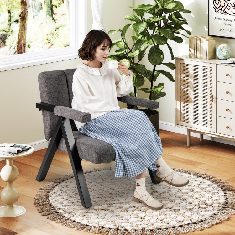 Oversized accent chair with gray fabric, ergonomic armrests, and metal frame, perfect for reading nooks or offices.