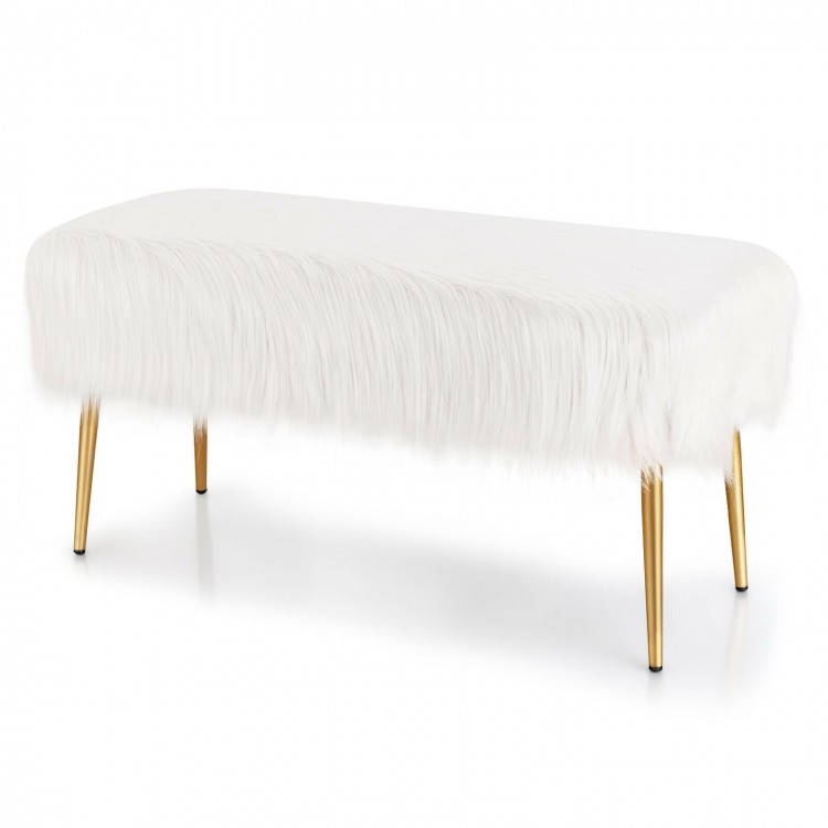 Faux fur vanity stool with golden metal legs, elegantly designed for versatile use as a stylish footrest or decorative.