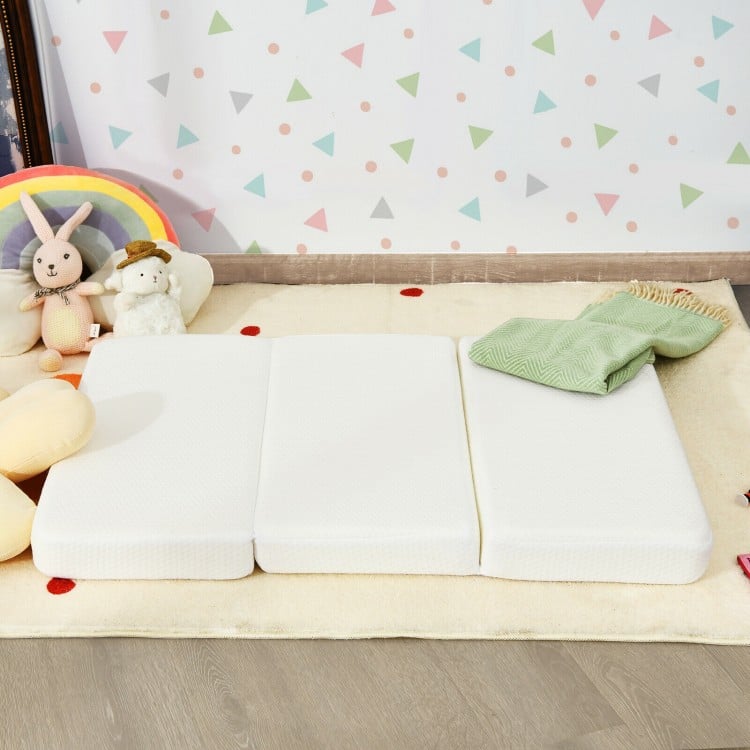 Tri-fold memory foam baby mattress with carrying bag, designed for comfort and easy storage, fits most playpens.