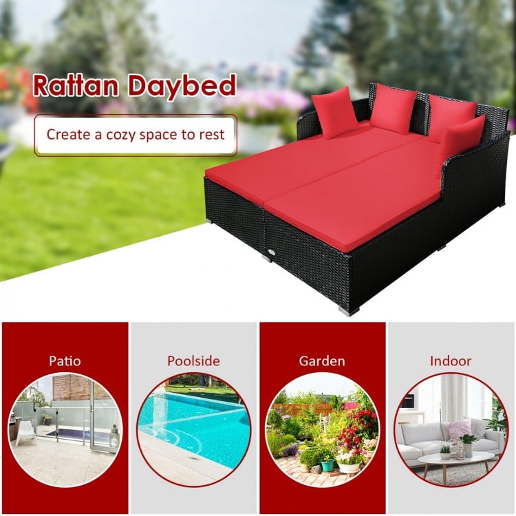 Spacious outdoor rattan daybed with red upholstered cushions, designed for comfort and support in patio or garden.