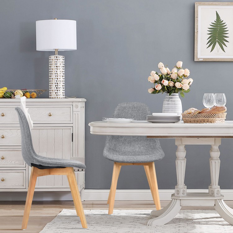 Modern dining chair set with wood legs and fabric cushion, featuring ergonomic backrest and sleek design for versatile.