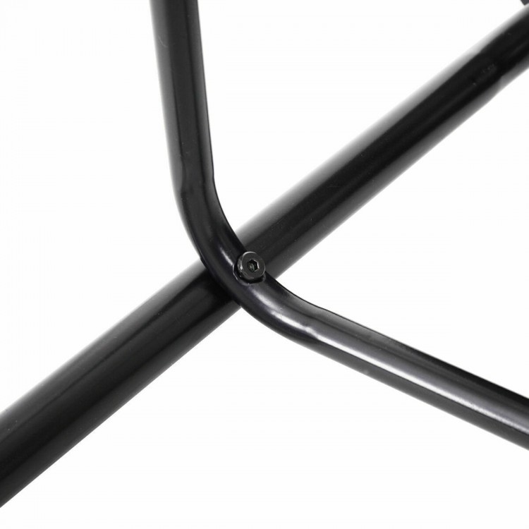 Close-up of the sturdy iron frame construction of a dining table set, showcasing its durable black finish and stable.