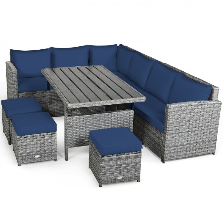 Sectional sofa with navy cushions from the 7-piece patio rattan dining set, ideal for creating a cozy outdoor space.