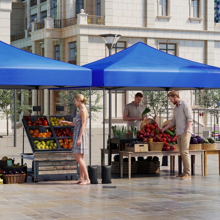 Pop-up canopy tent in blue, 9.5 x 9.5 feet, providing shade for outdoor markets and events with adjustable heights.