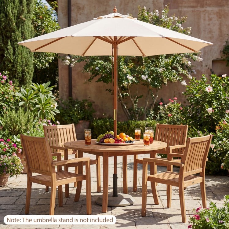 Beige 9 FT patio umbrella with 8 bamboo ribs, providing sun protection for outdoor dining and relaxation.