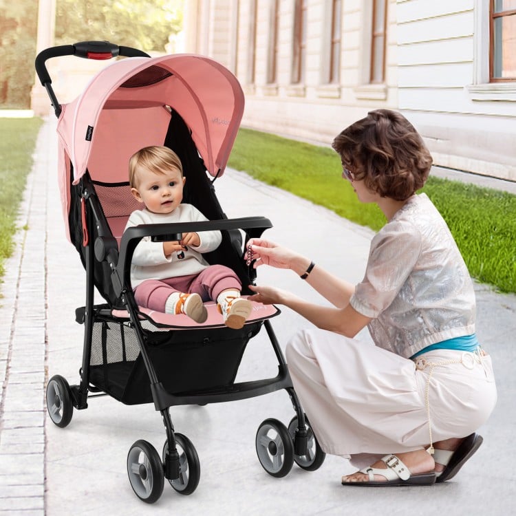 Toddler travel stroller in pink with adjustable backrest, 5-point harness, and canopy, ideal for airplane use.