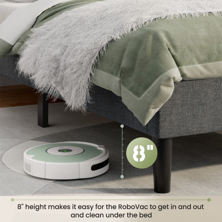 RoboVac under an upholstered bed base, showcasing 8" height for easy cleaning and modern button-tufted design.