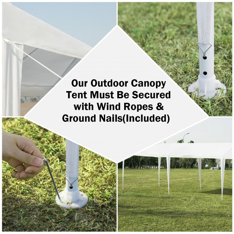 Close-up of the 10 x 20 feet waterproof canopy tent's base, secured with ground nails and wind ropes for stability.