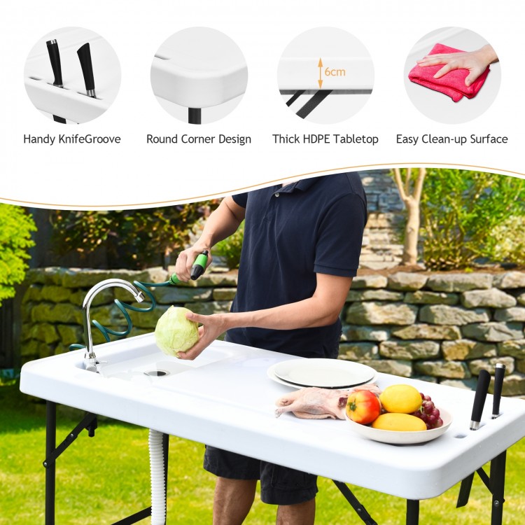 Folding cleaning sink table with sprayer, HDPE tabletop, and integrated sink, ideal for outdoor cleaning tasks.