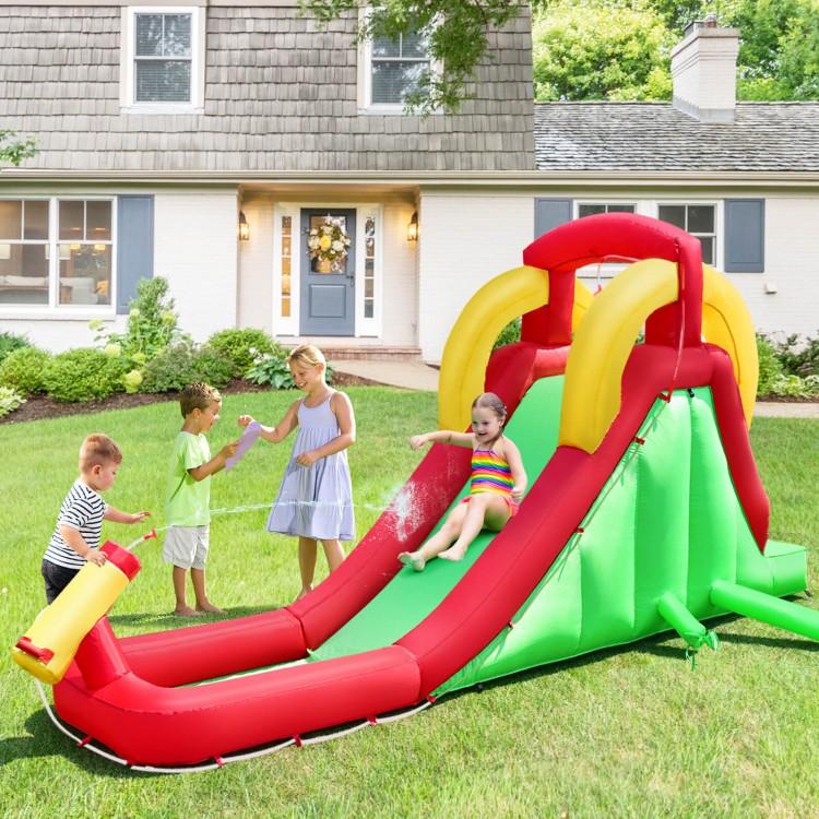 Inflatable water slide bounce house with climbing wall, featuring red and green colors, perfect for backyard fun.