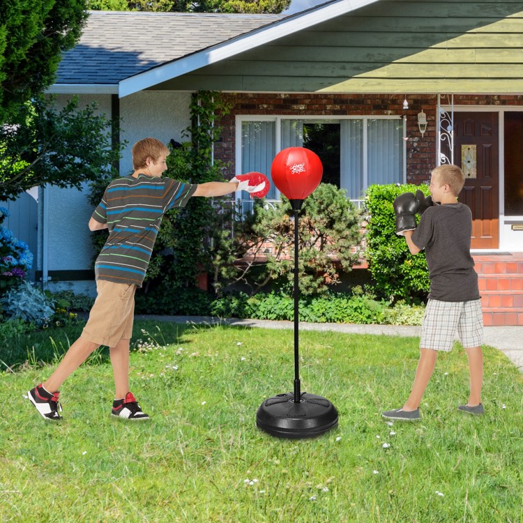 Adjustable height punching bag with stand, featuring kids boxing gloves, perfect for developing coordination and.