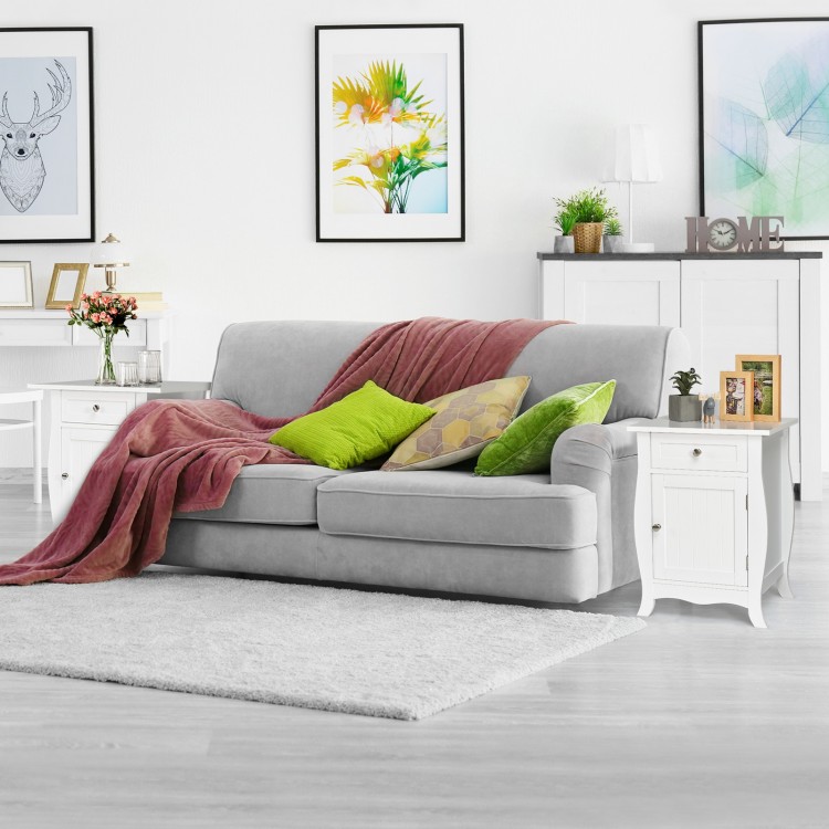 Wooden accent end table in white with drawer and cabinet, featuring a wave-shaped bottom for stylish storage.