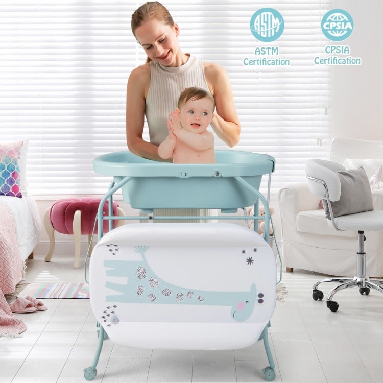 Folding baby changing table with bathtub in blue, showcasing a curved tray design and spacious storage for toiletries.
