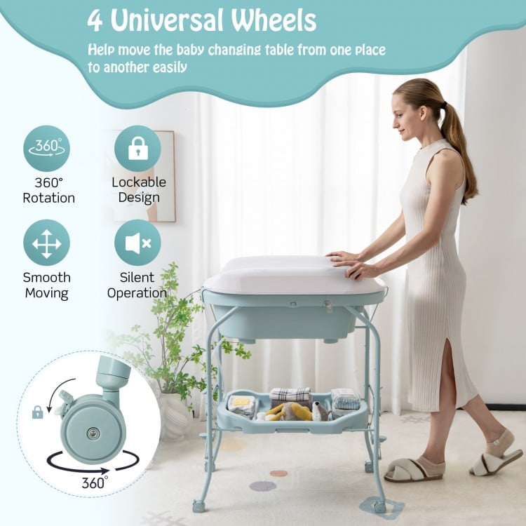 Folding baby changing table with bathtub, blue, featuring 4 universal wheels for easy mobility and storage.
