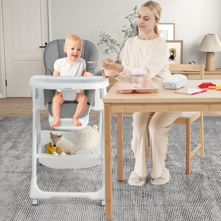 Convertible infant dining chair in gray with adjustable positions, featuring a removable cushion and safety harness for.
